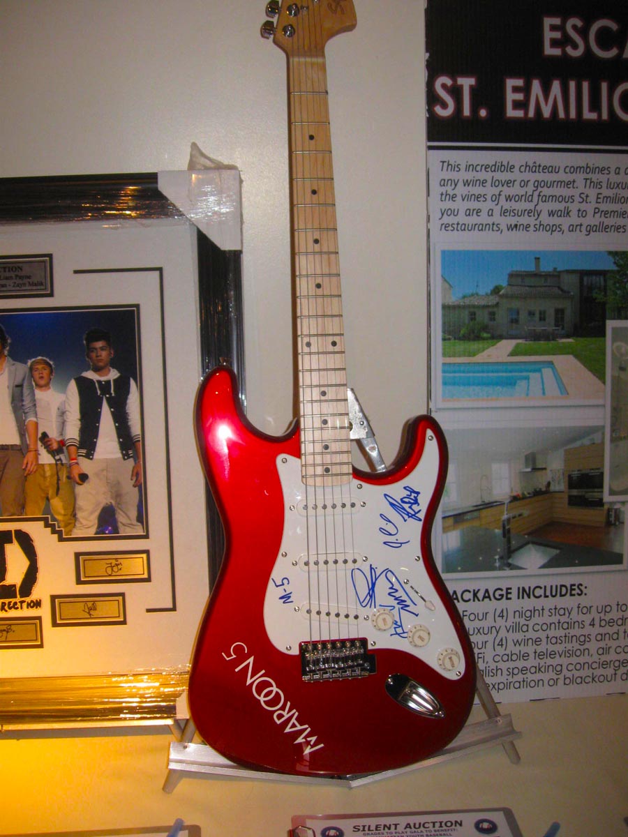 The Maroons signed guitar was a hot item at the auction.